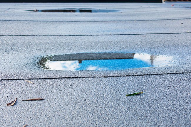 Pooling water on commercial roof