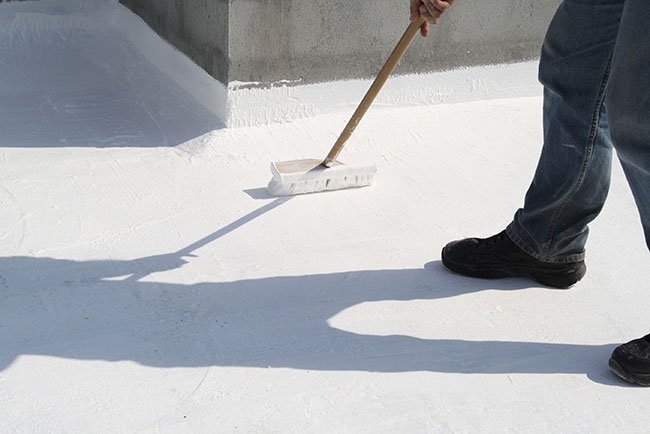 Applying roof coating to commercial roof