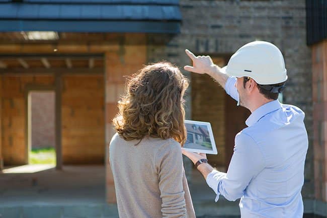 Contractor discussing roof with customer