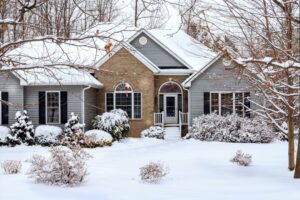 a home covered in snow during the winter