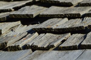 closeup of a wood shake roof in need of roof replacement omaha