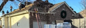 Residential roof replacement in progress, showcasing installation of impact resistant shingles by Anchor Roofing