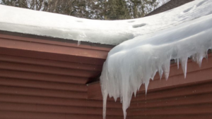 Roof filled with icicles that need a roof repair in Omaha