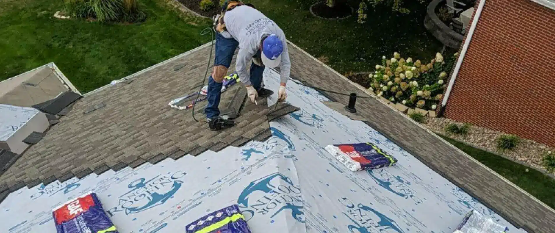 A skilled roofer from Anchor Roofing works on a residential roof installation in Omaha, NE.