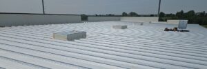 Commercial metal roof with ribbed pattern that had a roof repair in Omaha, NE