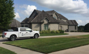 A large residential home with a steep roofline, representing roof replacement services in Omaha, Nebraska.