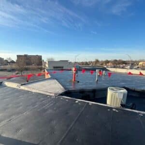 Outdoor shot of a flat rooftop undergoing a commercial roofing replacement in Omaha, NE