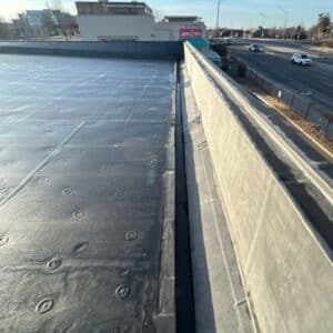Close-up of a flat roof with rolled roofing material in Omaha, NE