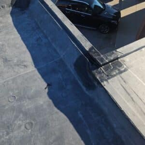 A flat commercial roof surface with metal flashing in Omaha, NE
