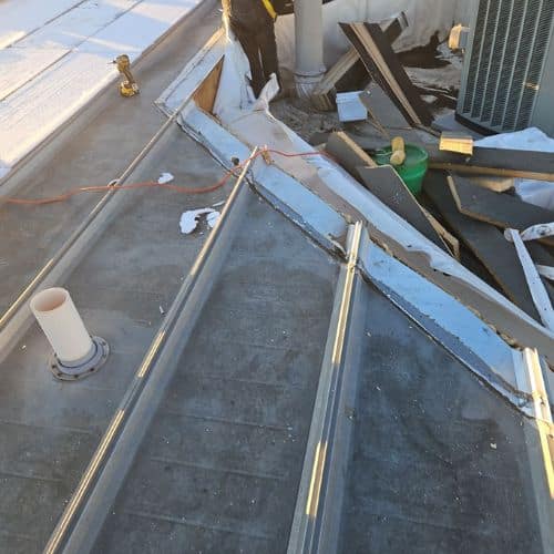 Well-maintained flat roof with proper slope to avoid ponding water