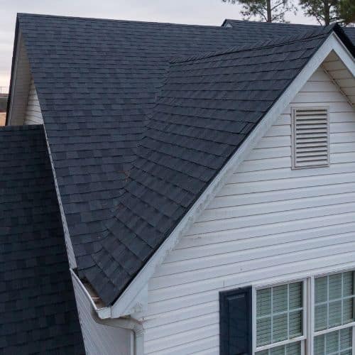 Closed valley gutter installation with shingles covering the valley flashing