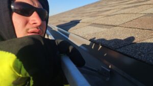 Close-up of leaf guard installed on residential gutter system in Omaha by Anchor Roofing