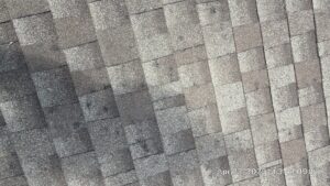 roof inspection showing hail damaged roof in Gretna, NE in need of replacement