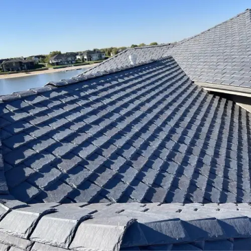 Close-up view of high-quality architectural shingles demonstrating durability factors in how long is a roof warranty by Anchor Roofing in Omaha, NE