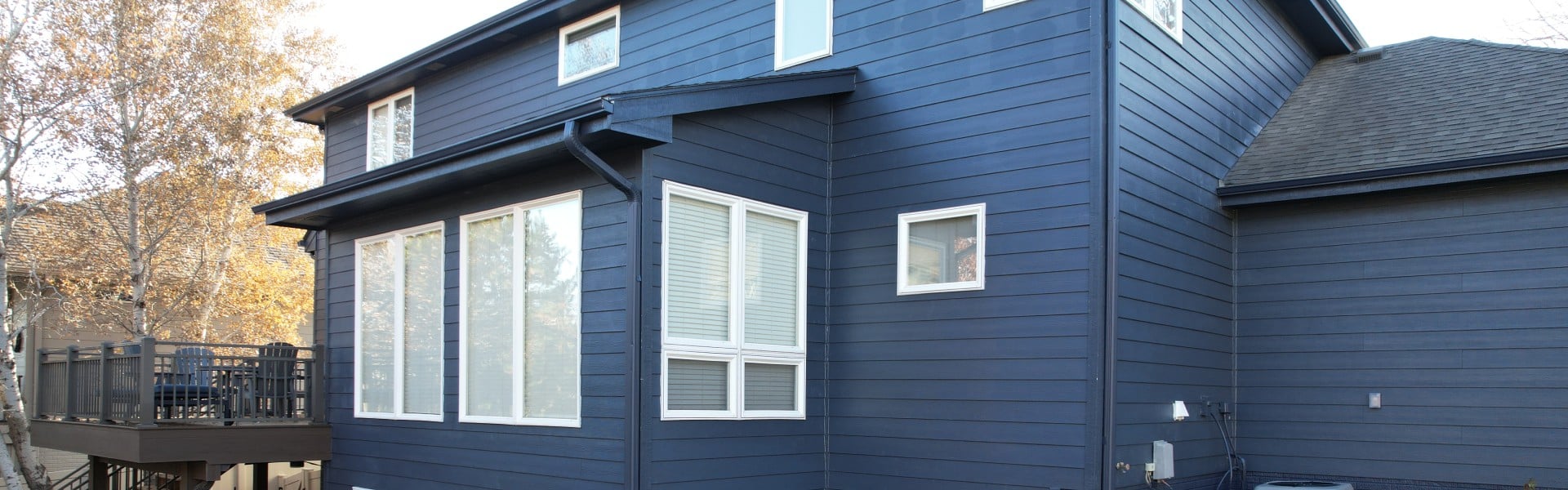 Home featuring Hardie Board siding showing engineered wood vs Hardie exterior comparison by Anchor Roofing in Omaha