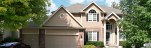 A finished residential home exterior showing the work of a top-rated siding installer in Omaha by Anchor Roofing.