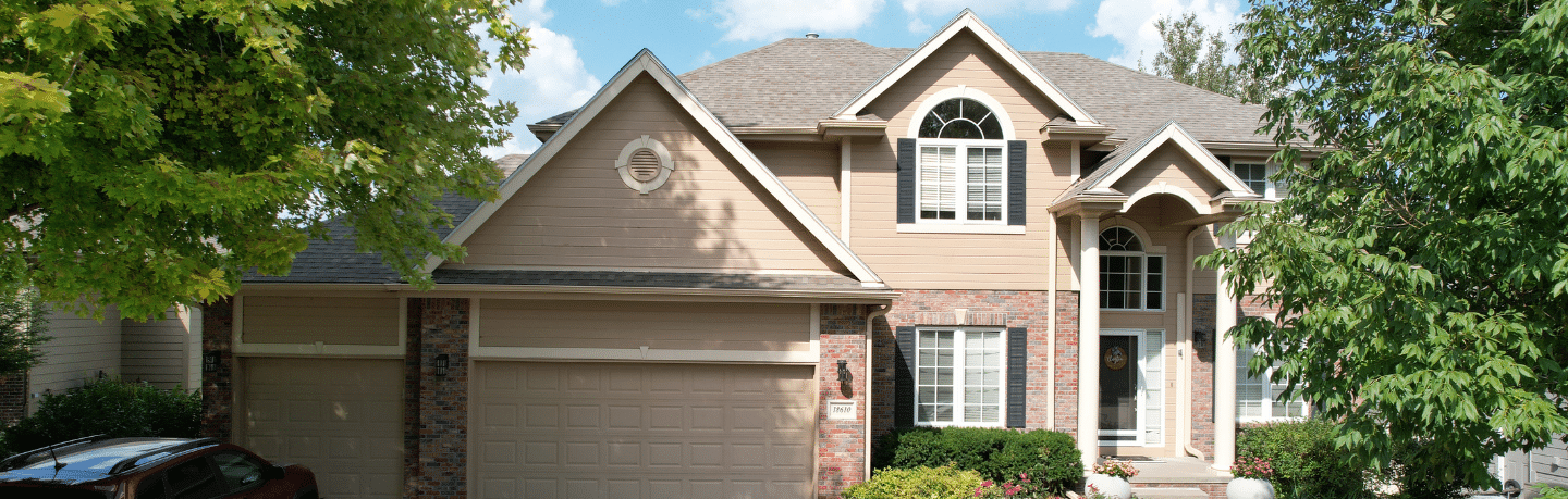 A finished residential home exterior showing the work of a top-rated siding installer in Omaha by Anchor Roofing.