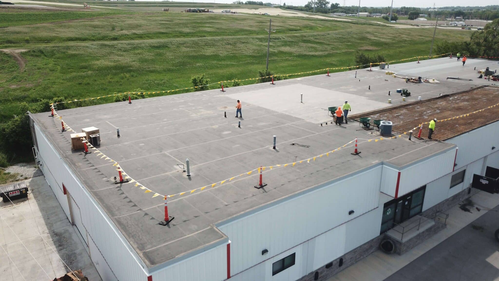 Crew conducting property management roofing service in Omaha by Anchor Roofing