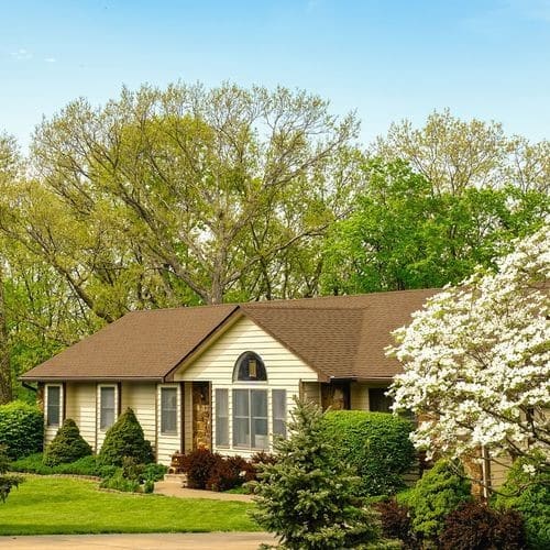 Omaha home with a newly installed storm-resistant asphalt roof, impact-resistant shingles in Omaha by Anchor Roofing