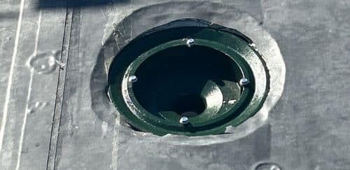 Clogged roof drain causing ponding water on a flat commercial roof