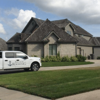 A large residential home with a steep roofline, representing roof replacement services in Omaha, Nebraska.