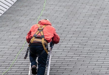 Contractor inspecting roof